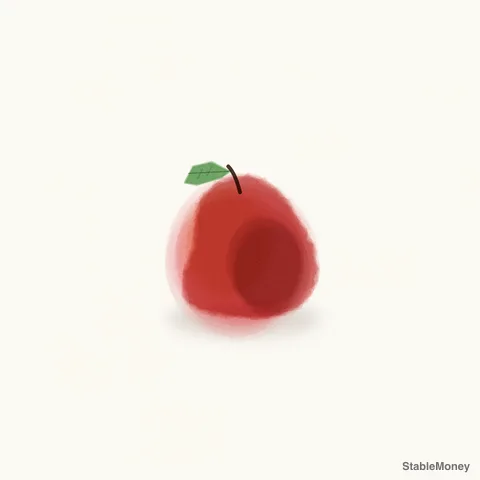 a red apple and a leaf